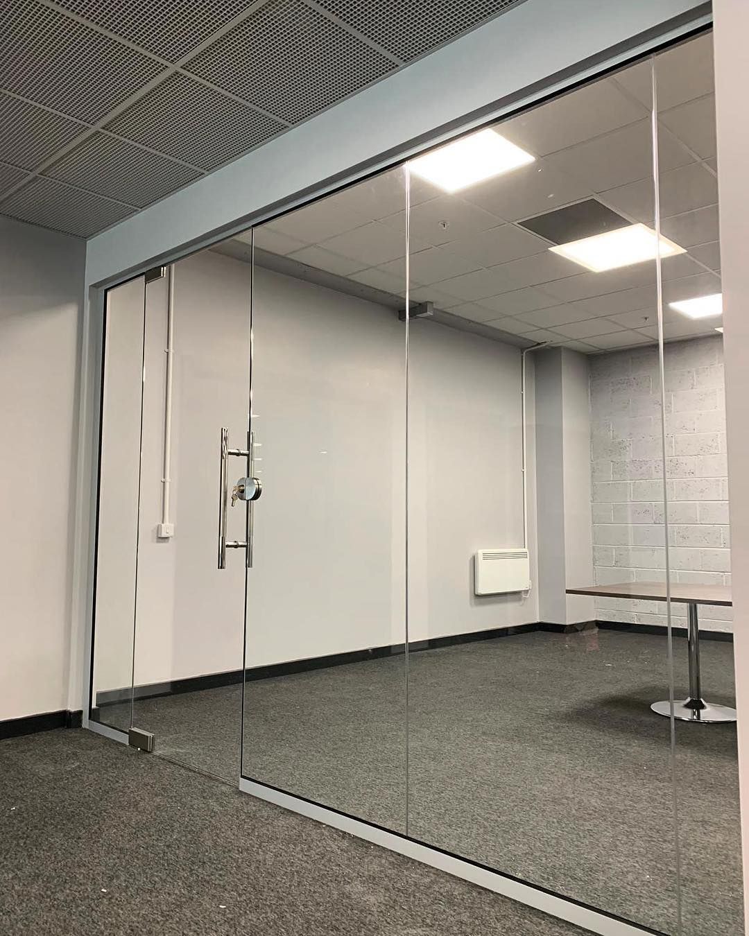 Frameless glass office partition fabricated in Karachi